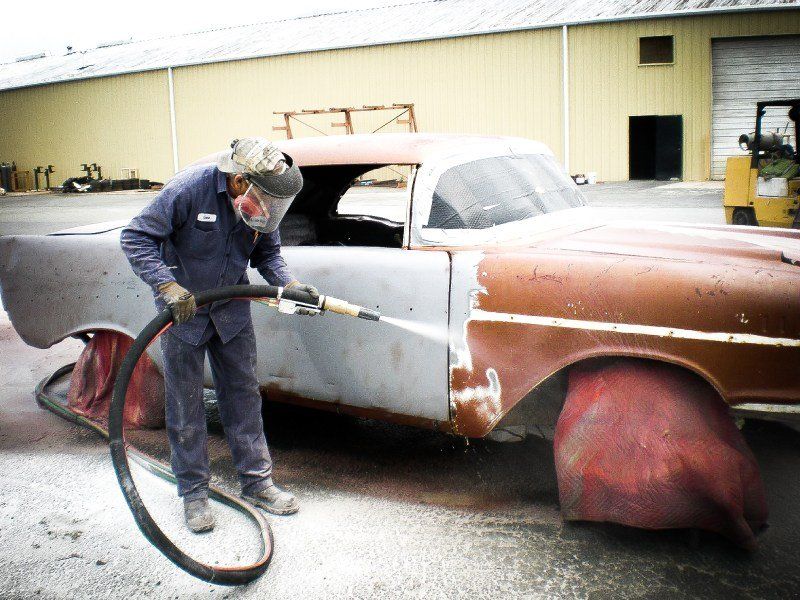 Man Removing Car Paint — Indiana, PA — Keystone Dustless Mobile Media Blasting LLC