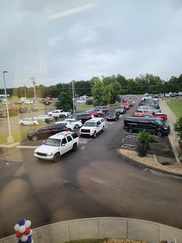 A lot of cars are parked in a parking lot.