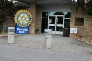 The front of a building with a rotary logo on it