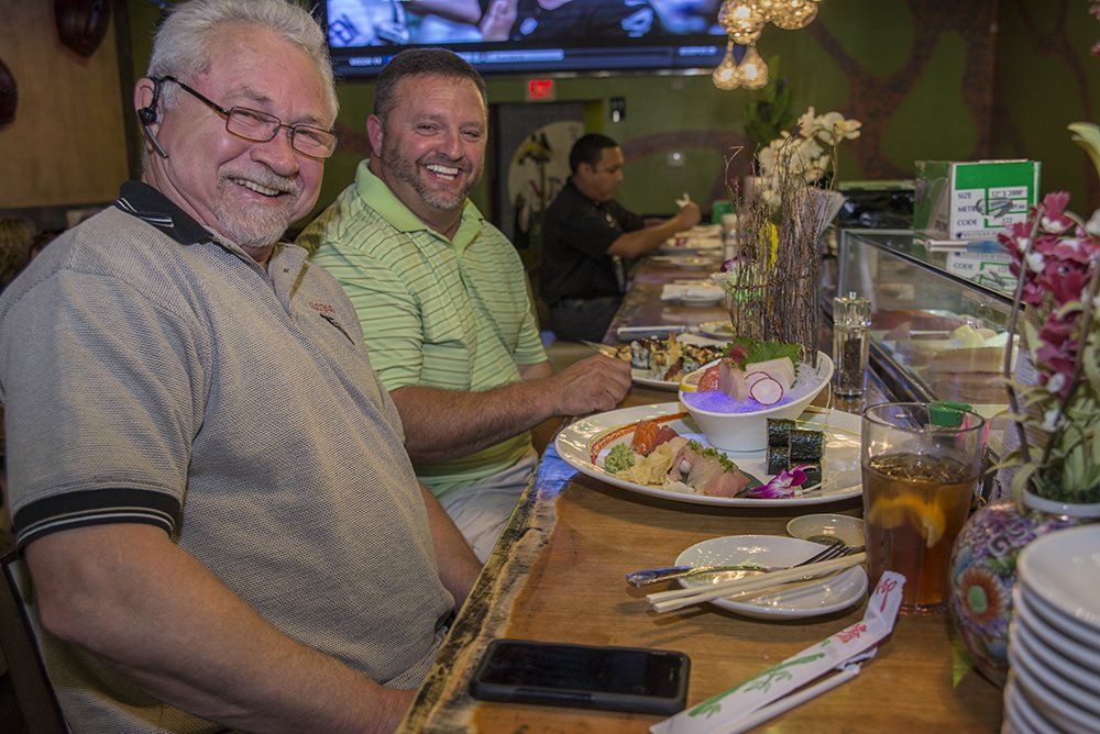 Guests enjoying hibachi dining at Volcano Steak & Sushi