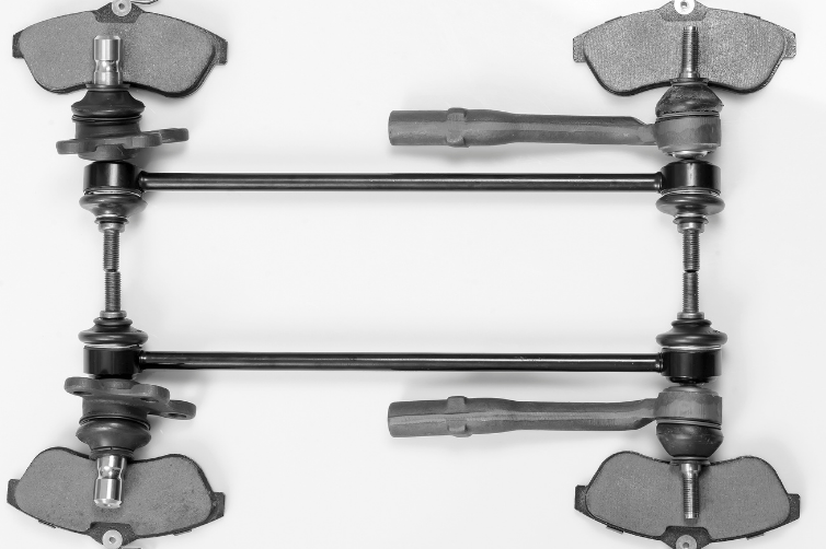 Metal suspension assembly with four clamps and two horizontal bars on a white background