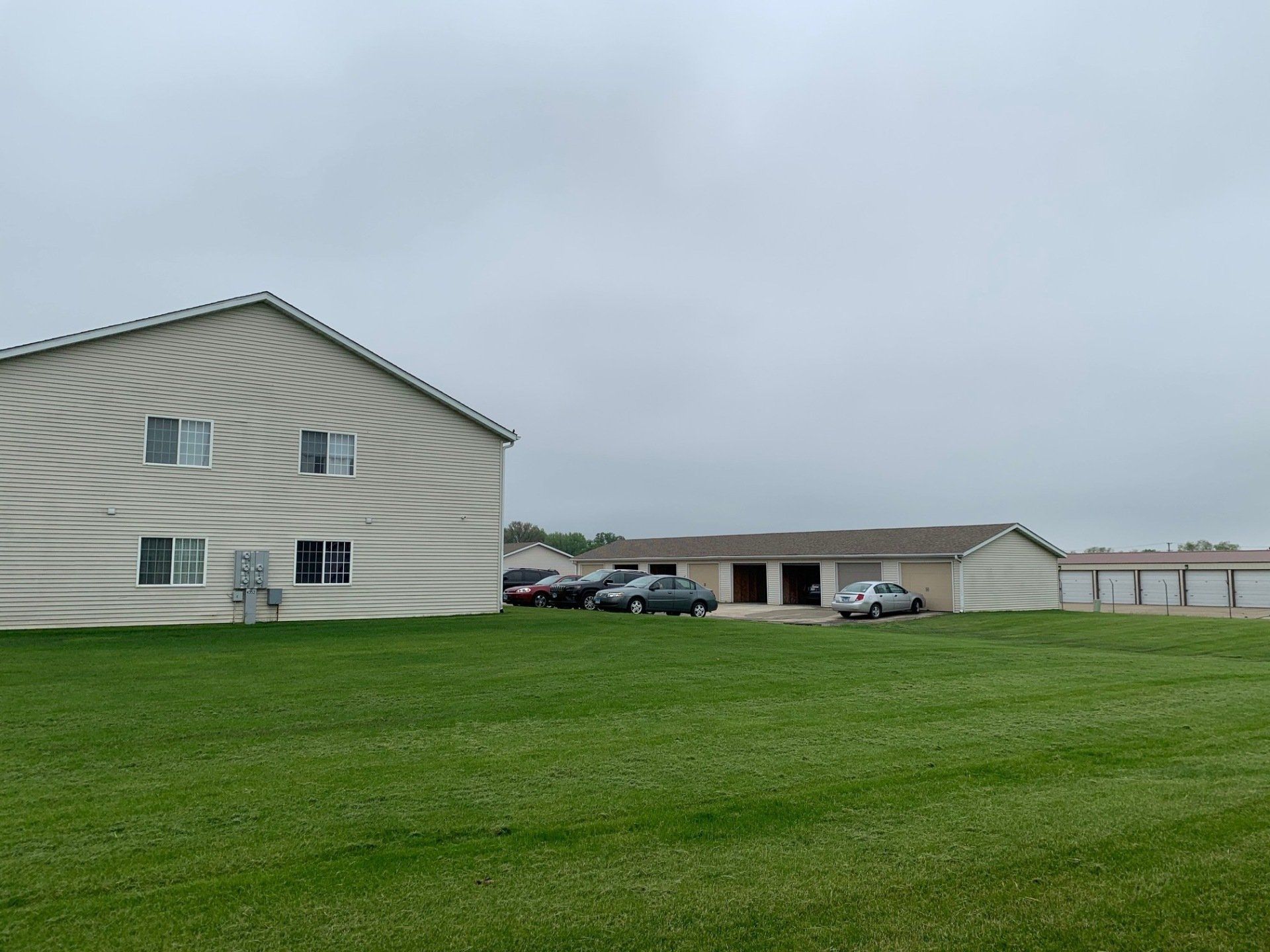 A large house with a lot of grass in front of it.