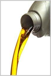 Pouring Oil — Engine Oil and Heating Fuels in Portland, IN Pouring Oil — Engine Oil and Heating Fuels in Portland, IN