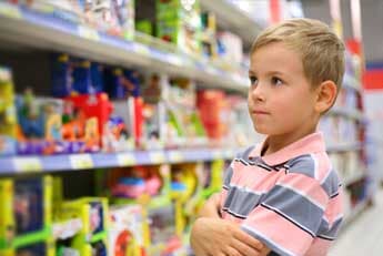 Games for Sale — Boy wondering in toy store in Seattle, WA Games for Sale — Boy wondering in toy store in Seattle, WA