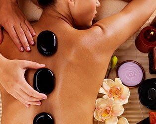 Adult Woman Having Hot Stone Massage - Spa in Standish, ME Adult Woman Having Hot Stone Massage - Spa in Standish, ME