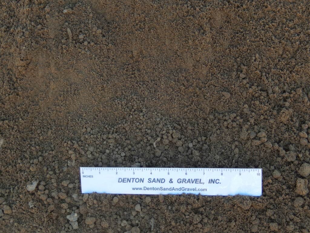 Brown soil with a white ruler from Benton Sand & Gravel, Inc.