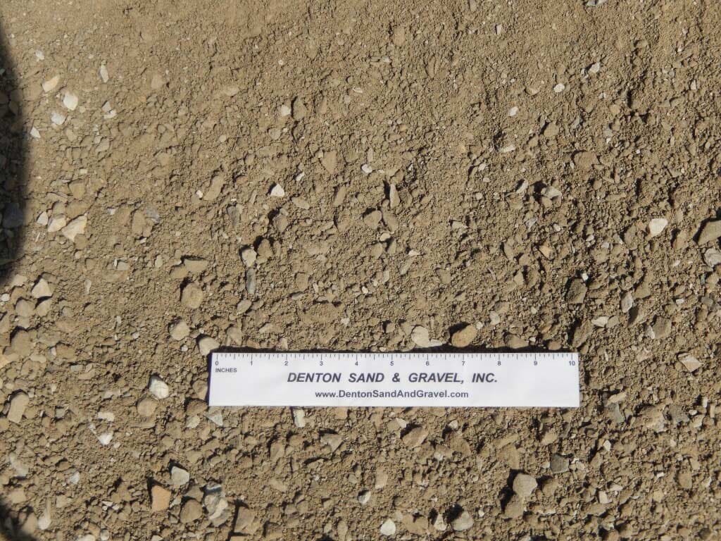 Brown gravel with a ruler in the center labeled 