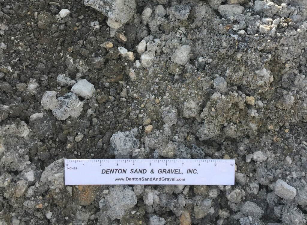 Pile of gravel with a ruler from Denton Sand & Gravel.