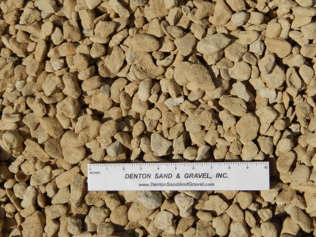 Tan gravel with a ruler from Denton Sand & Gravel.