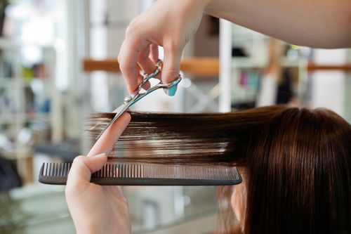 Girl enjoying a fantastic haircut in Columbia, MO