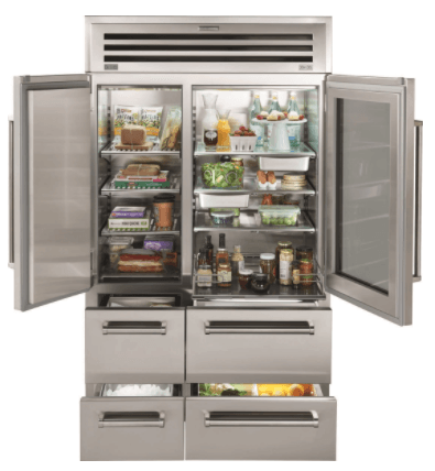 A stainless steel luxury refrigerator with double doors open to reveal interior shelves and four lower storage drawers.