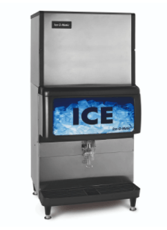 Stainless steel Ice-O-Matic ice machine with a black dispenser panel displaying the word 