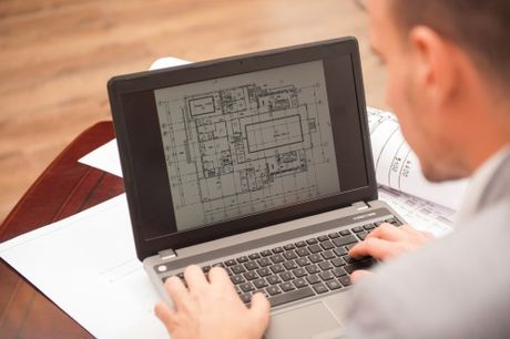 Individual working on the laptop with design