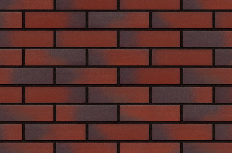 Red and dark brown brick wall with dark mortar.