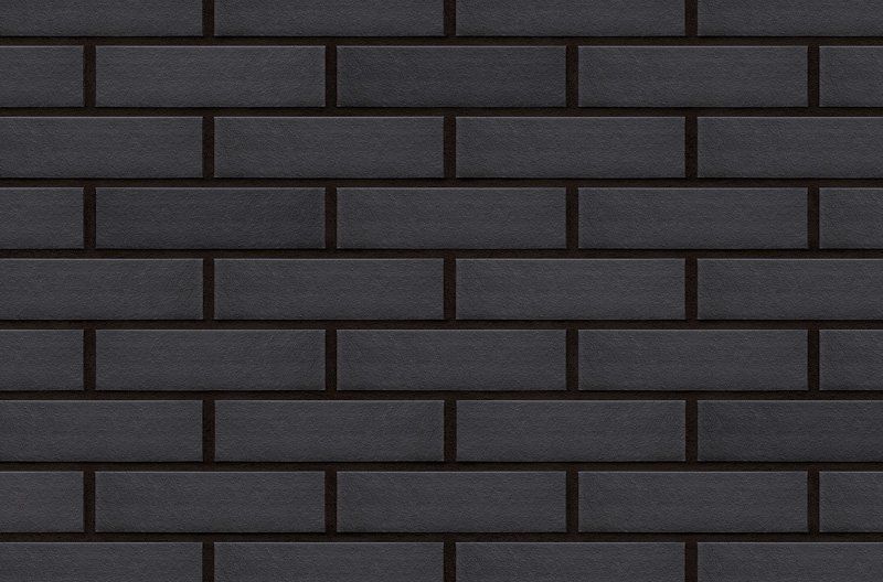 Black brick wall with dark grout.