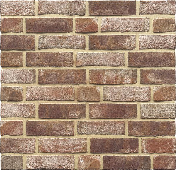 Brick wall with red-brown bricks and light yellow mortar.