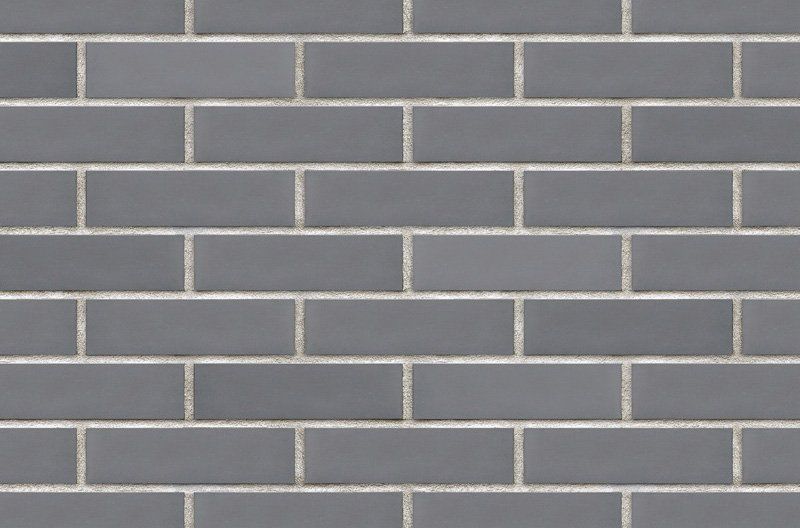 Gray rectangular tiles arranged in a brick pattern with white grout lines.