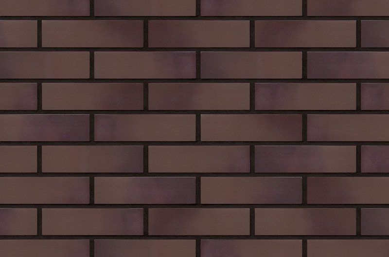 Dark brown brick wall, with dark mortar between the bricks.