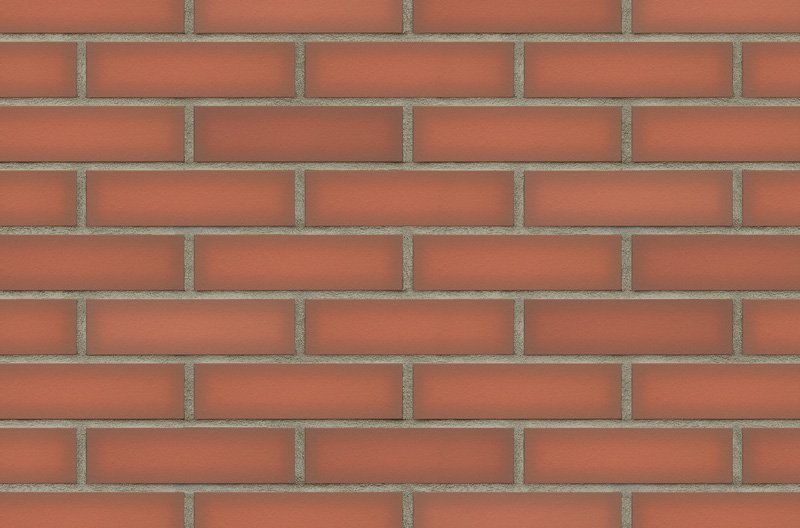 Red brick wall with gray mortar.