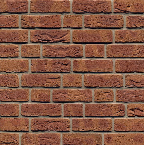 Brick wall with reddish-brown bricks and gray mortar.