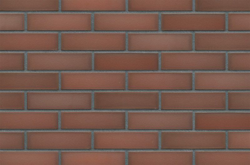 Red brick wall with gray mortar.