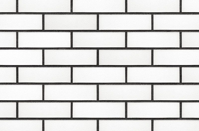 White brick wall with dark gray mortar lines.