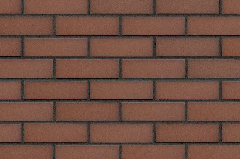 Red brick wall with dark gray mortar joints.