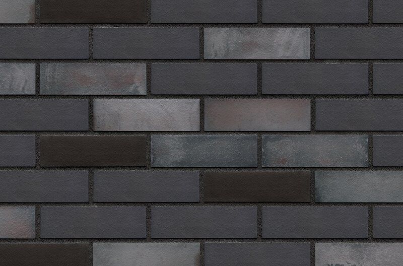 Dark gray brick wall with varied tones and visible mortar.
