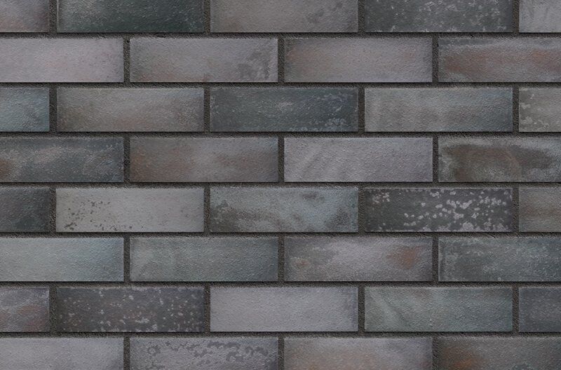 Gray and blue weathered brick wall.
