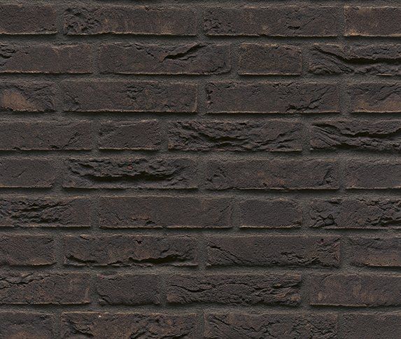 Dark brown brick wall.