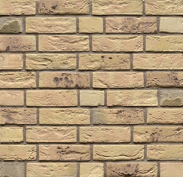 Tan brick wall, with irregular surface and subtle color variations.