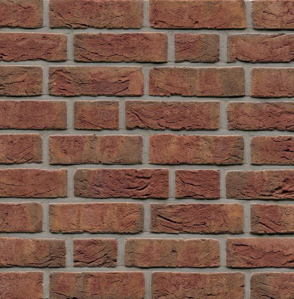 Red brick wall with gray mortar.
