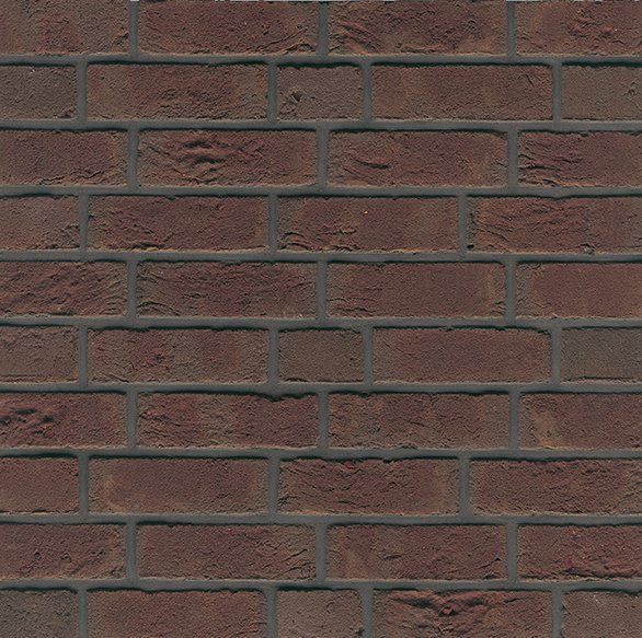 Red brick wall with dark gray mortar.