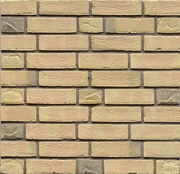 Yellow and tan brick wall in running bond pattern.