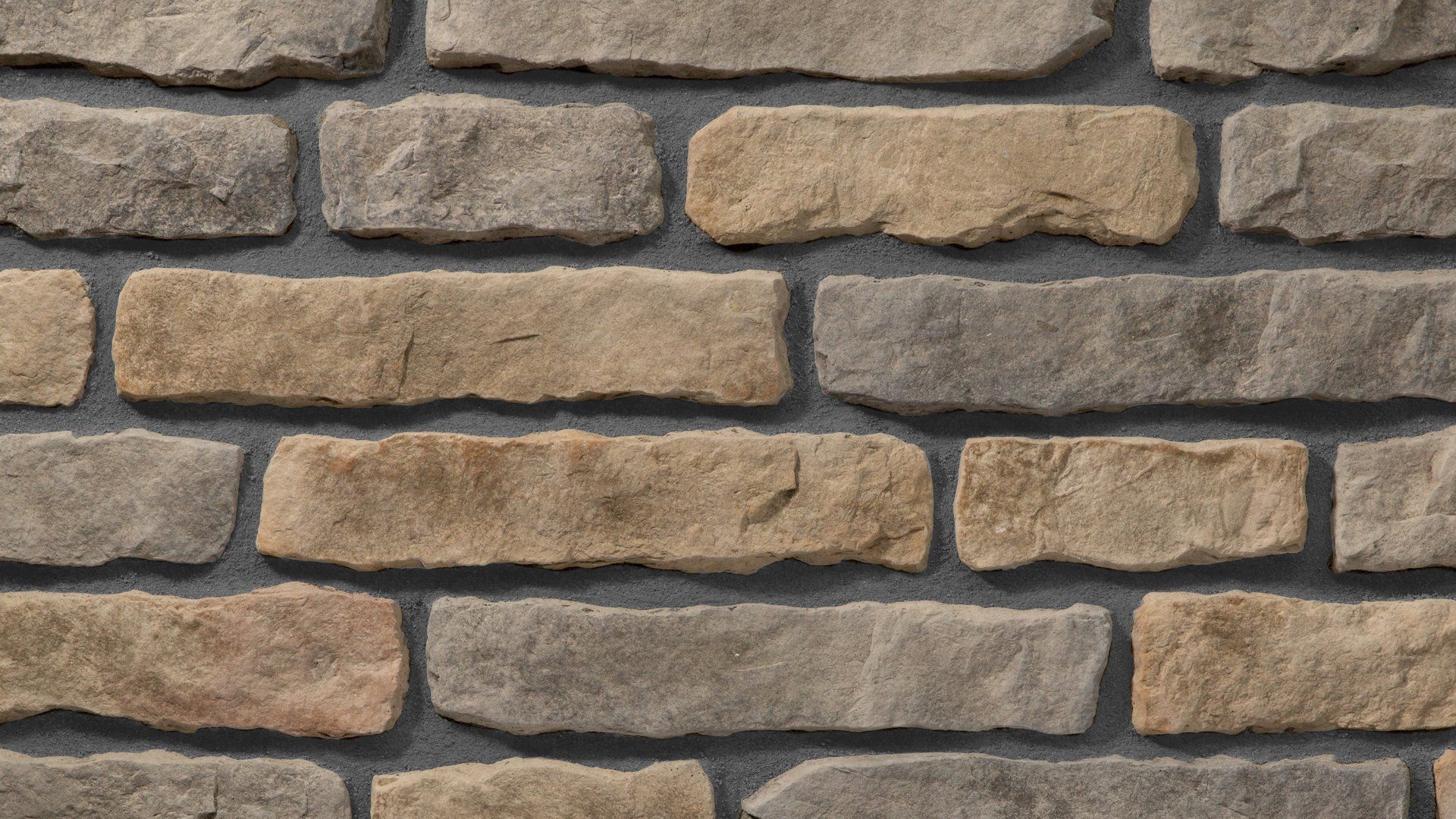 Stone veneer wall with varying shades of beige, tan, and gray bricks with dark gray mortar.
