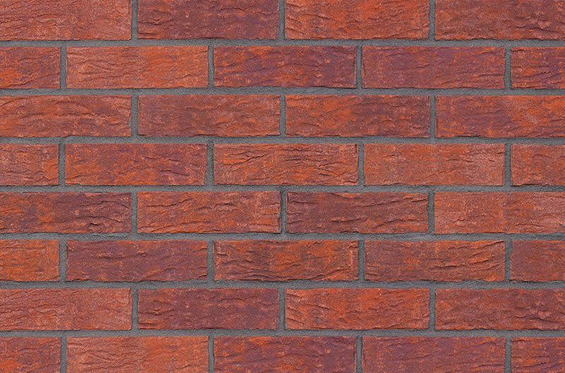 Red brick wall with dark mortar joints.
