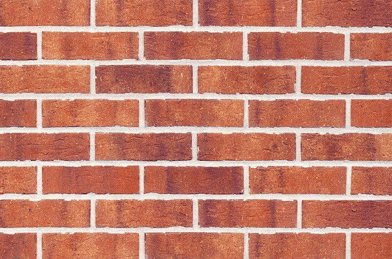Red brick wall with white mortar.