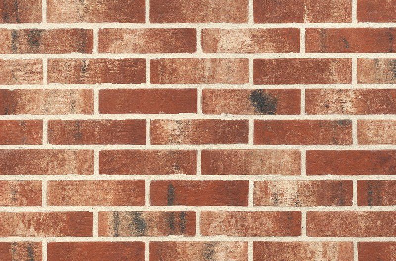 Red brick wall with white mortar.