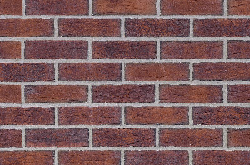 Red brick wall with white mortar.