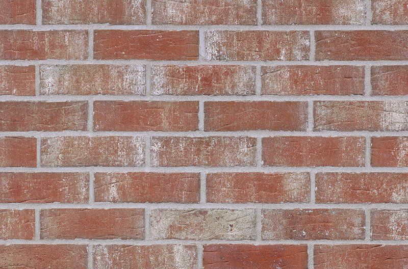 Red brick wall with white mortar.