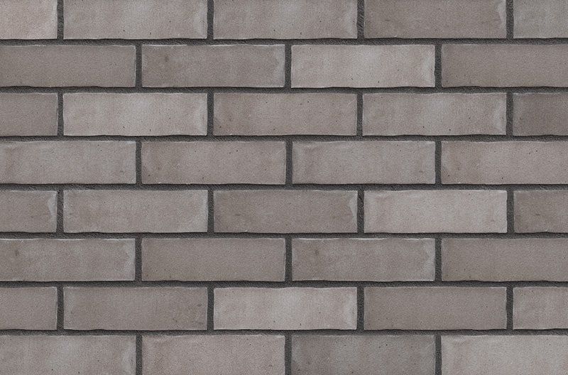 Gray brick wall with dark mortar.