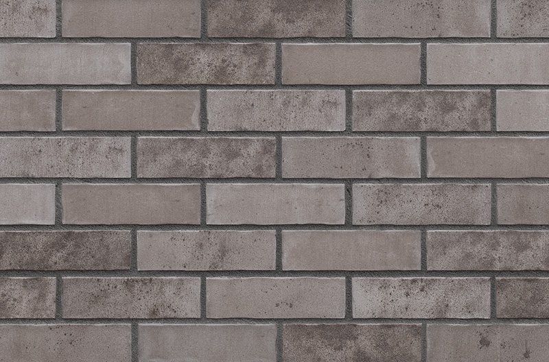 Gray brick wall with darker gray mortar.
