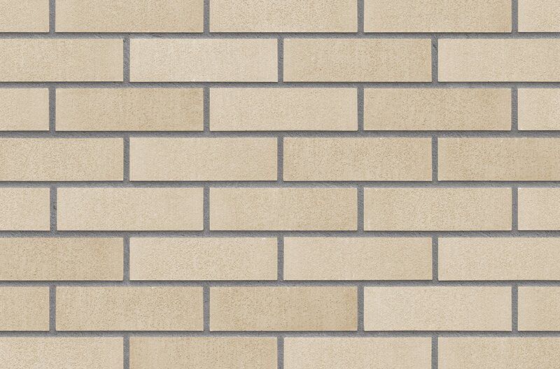 Light tan brick wall with gray mortar.