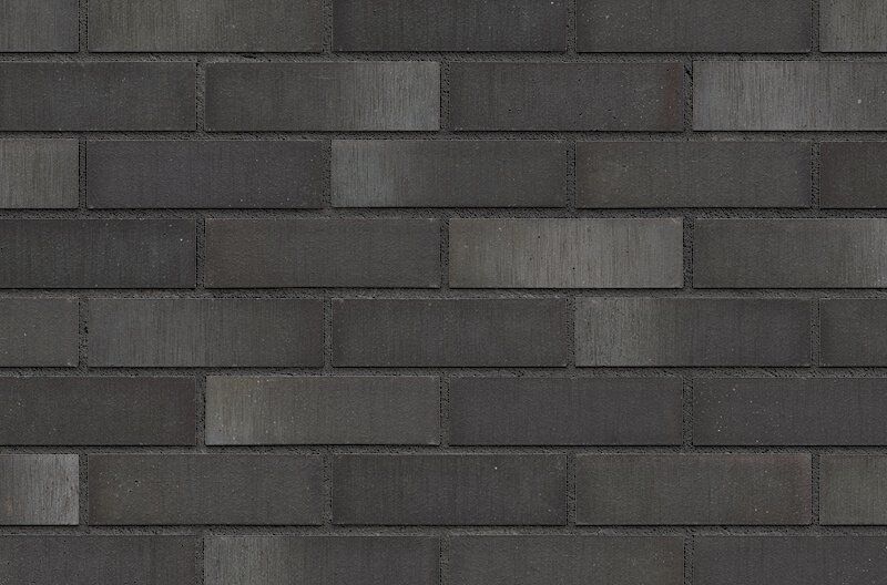 Dark gray brick wall.