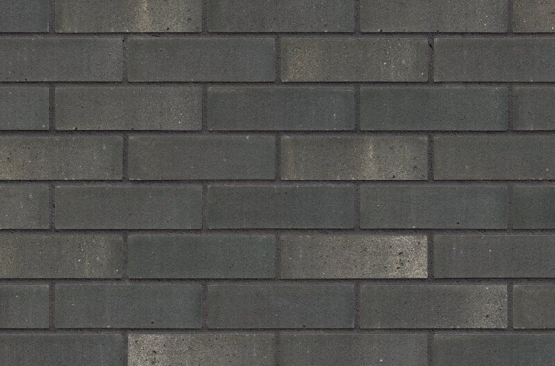 Dark gray brick wall.