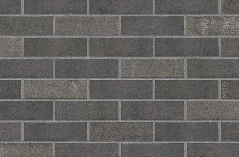 Dark gray brick wall with light gray mortar.