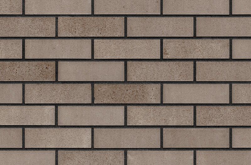 Tan brick wall with dark gray mortar lines.