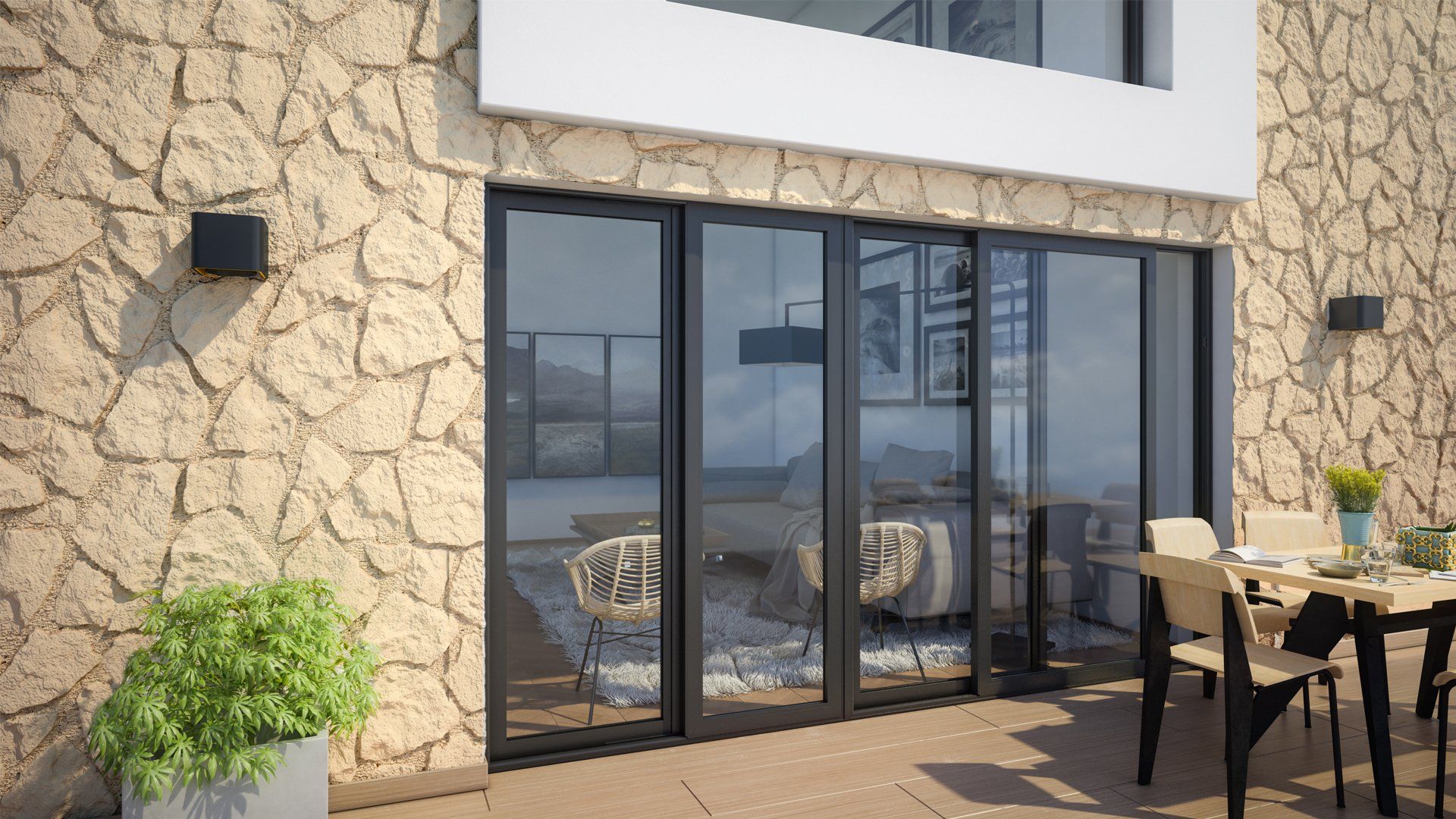Stone wall with black-framed glass doors leading to a patio with outdoor furniture.