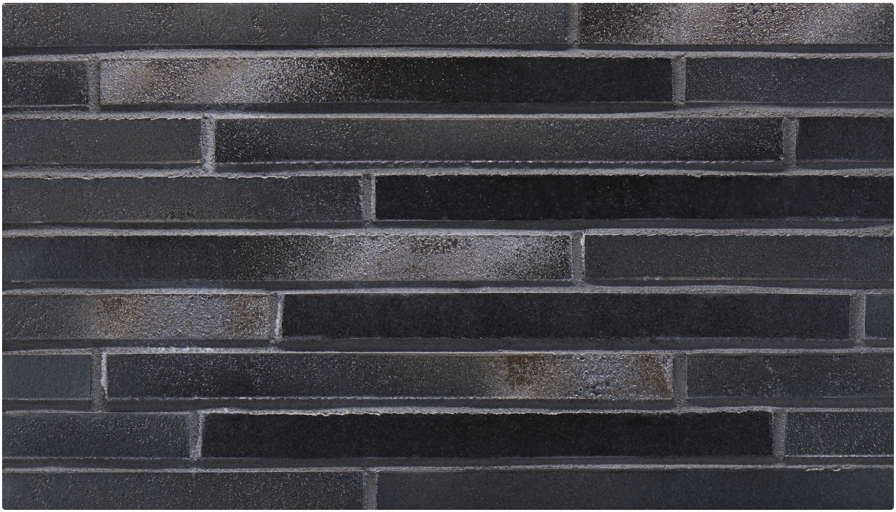 Dark gray rectangular tiles arranged in a staggered, brick-like pattern.
