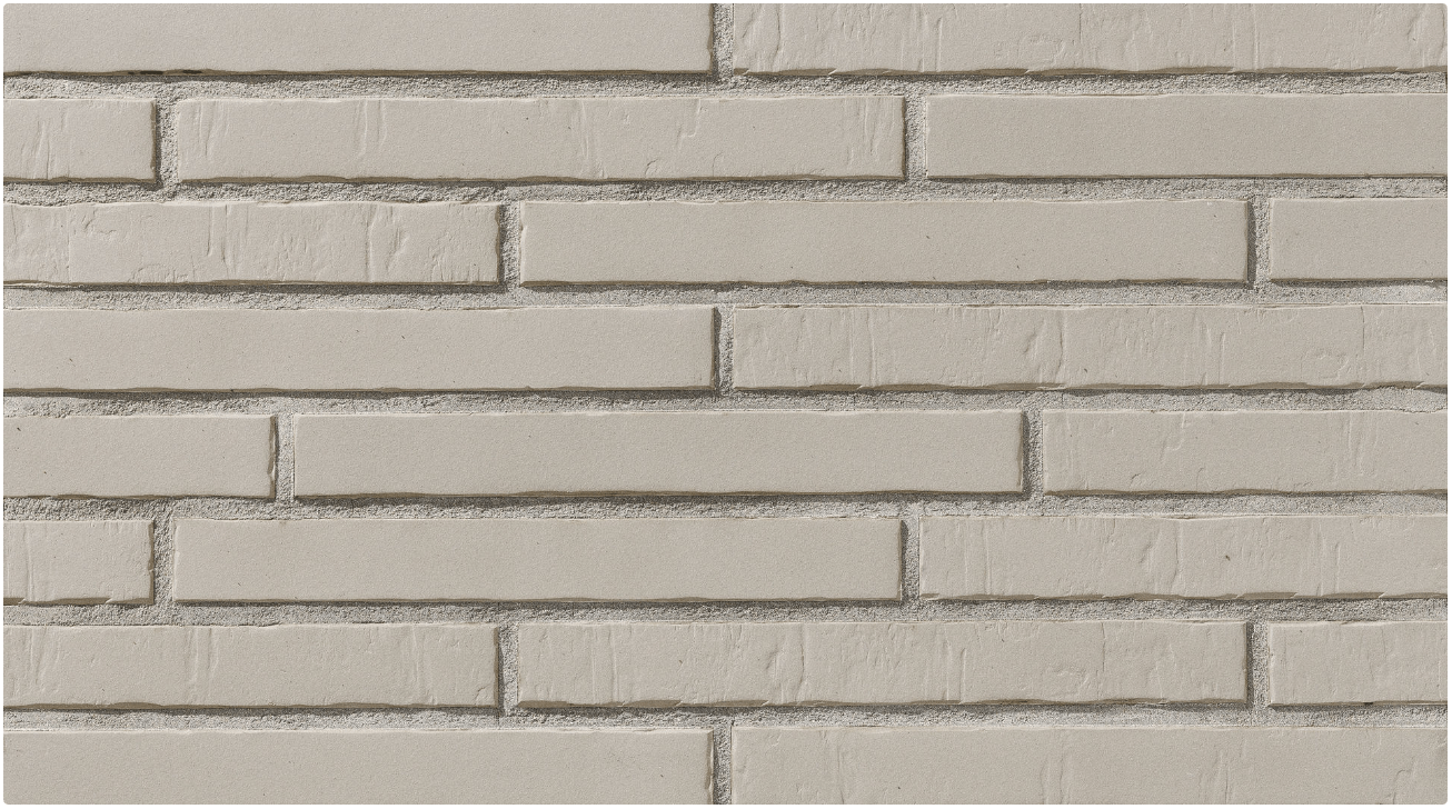 Light gray brick wall with textured surface and dark mortar lines.